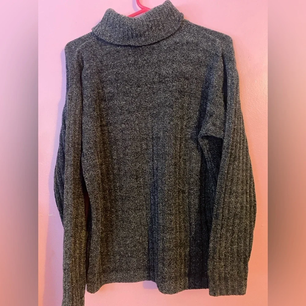 Super Soft Distressed Turtle Neck Sweater with Colorful Repairs.